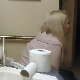 A mature, older blonde woman takes a runny shit and farts repeatedly while sitting on a toilet in her bathroom late at night. Some nose blowing, too. Presented in 720P HD. About 2.5 minutes.